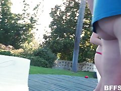 Girls are having a lot of fun in the garden with their neighbor who was watching them